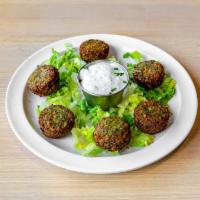 Falafel appetizer · pan fried croquettes of ground chickpeas, onion, and  herbs served with tzatziki
*GF* *VEGE...