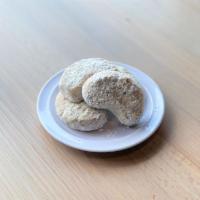 Kourabiedes · made with almonds and dusted with confectioners sugar