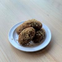 Melomakarona · soft cookies baked dry then dipped in a syrup of honey, orange, cinnamon, and cloves