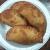 Cheeses Pies  · 4 pieces. Fresh dough filled with feta cheese and spices then fried.