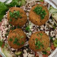 Falafel Salad · Falafel and fresh crisp greens with feta cheese and olives covered in our traditional house ...