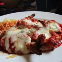 Shrimp Parmigiana · Made or covered with Parmesan cheese.