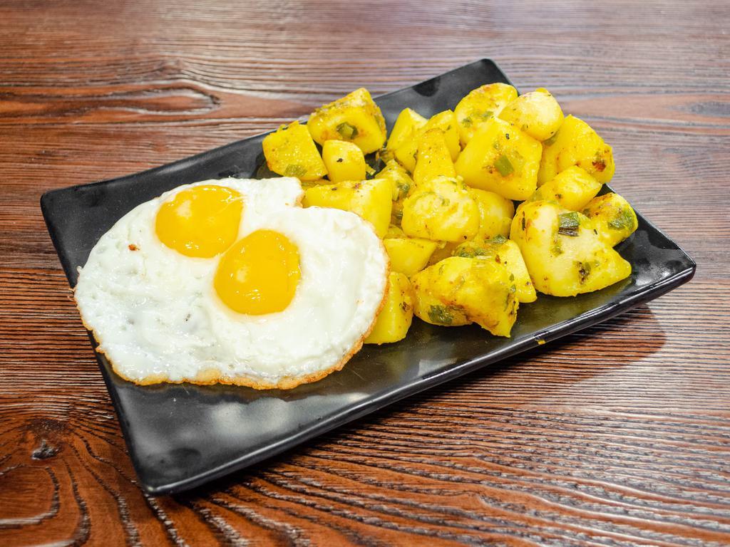 8. Papas de la Casa, Huevos al Gusto · Homemade potatoes with eggs any style.