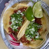 2 Chorizo Tacos · Spicy sausage. Served on soft corn tortilla with onions and cilantro.