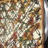 Caprese Pizza · Made with Brooklyn crust and topped with fresh mozzarella slice, tomato, balsamic glaze and ...