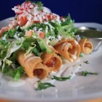 Tacos Dorados (Flautas) · Order of 4 dip fry tacos. Served with lettuce, tomatoes, onions, sour cream, grated cheese a...