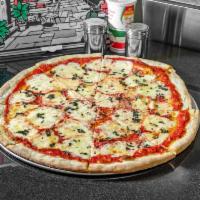 Margherita Pizza · Fresh mozzarella, fresh basil, extra virgin olive oil and plum tomatoes.