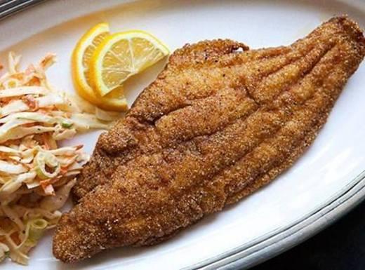 Fried Catfish Fillet · Large Catfish Filet dipped in buttermilk and seasonings, then gently fried until golden brown. Served with lemon and tartar sauce.