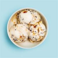 Vegan Coconut Caramel Chip · Coconut milk base with chunks of caramelized coconut milk and magicked dark chocolate chips....