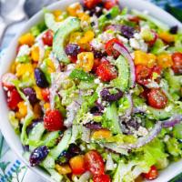 Greek Salad · Mixed lettuce with feta cheese, onion, freshly grated cheddar, sun dried tomatoes, black oli...