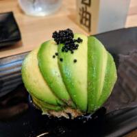 Tuna Dragon Ball · Spicy tuna wrapped in avocado, topped with black tobiko and yuzu sauce.