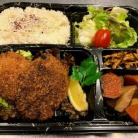 Menchi Katsu  · Fried ground beef cutlet made with cabbage, onion, and egg. Comes with simmered root vegetab...