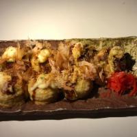 Takoyaki · Savory mini pancake stuffed with chopped octopus and vegetables. Takoyaki sauce, mayonnaise ...