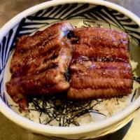 Una Don · Grilled eel over rice with sansho pepper on top.