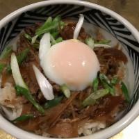 Gyu-Shigure Don · Simmered sliced beef, onion and burdock all over rice with poached egg on top.