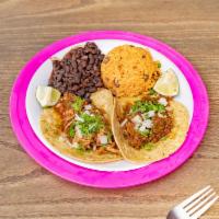 6. Taco Plate · 2 tacos in delicious hatch green Chile corn and wheat tortillas with your choice of fillings...