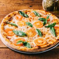 Margherita Brasileira Pizza · Fresh tomato and fresh basil. Included mozzarella and tomato sauce.