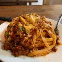 Pasta Bolognese · pappardelle pasta topped with all homemade our delicious homemade bolognese sauce