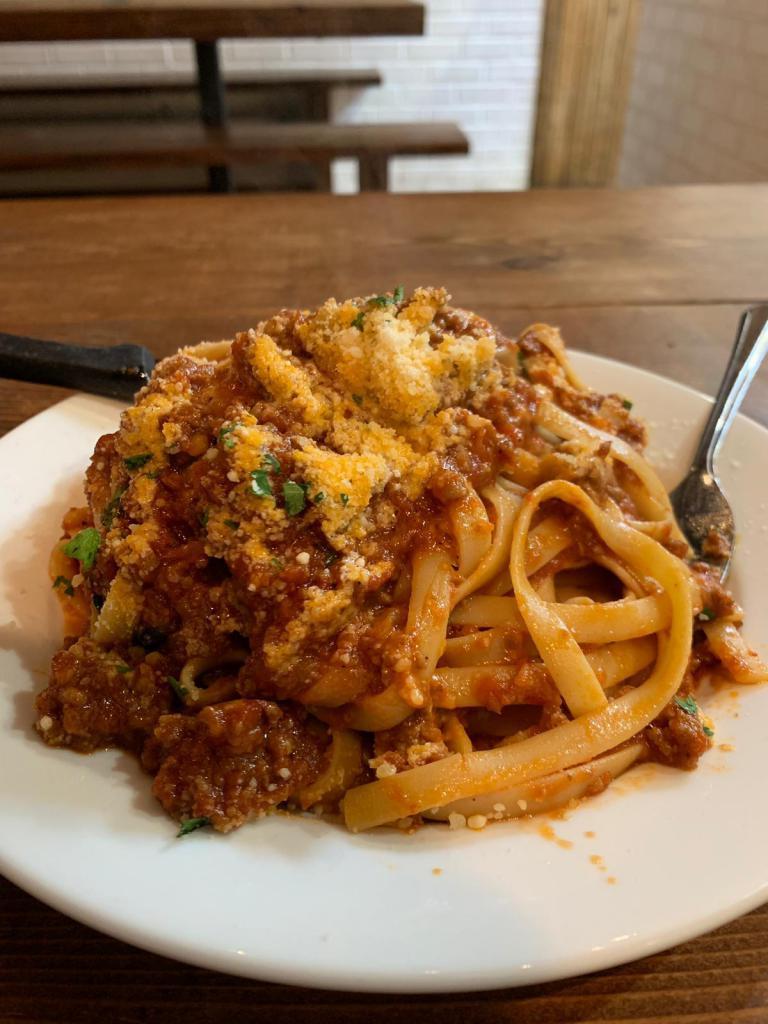 Pasta Bolognese · pappardelle pasta topped with all homemade our delicious homemade bolognese sauce