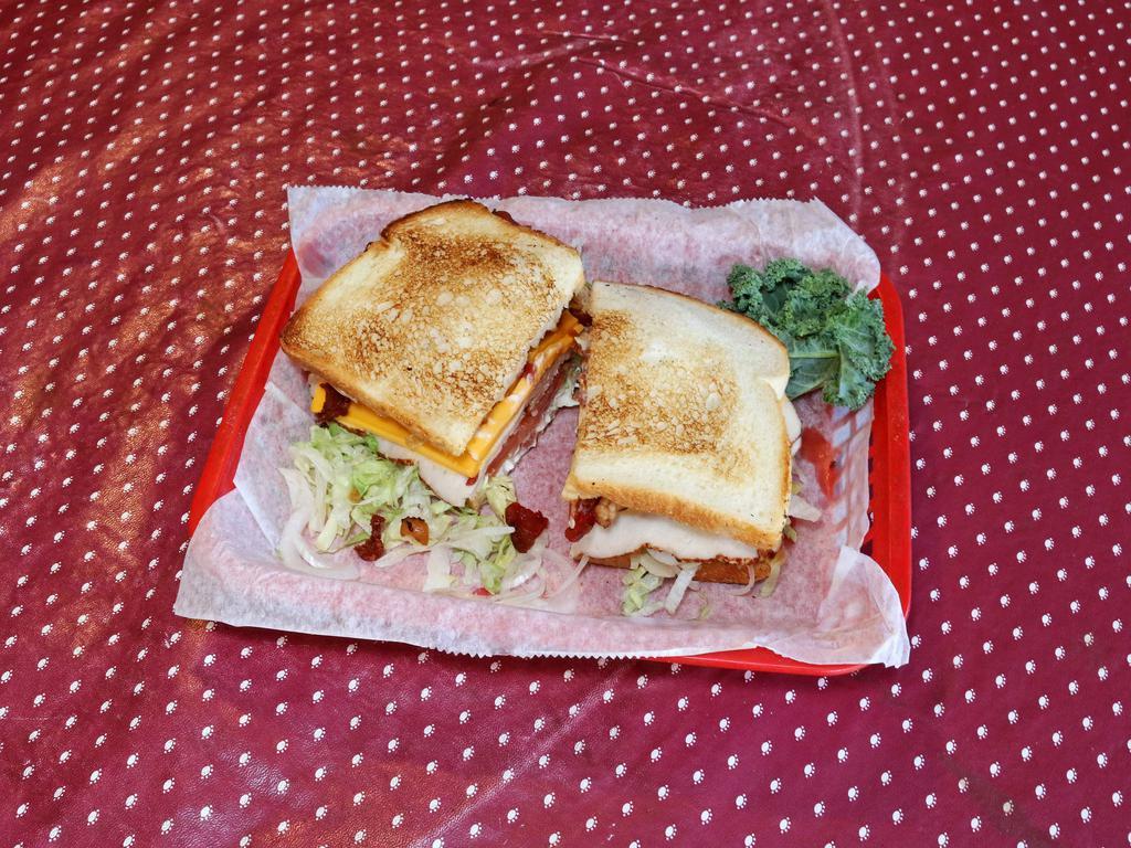 Turkey and Bacon Club Sandwich · toasted italian bread with mayo, lettuce, onion. tomato, turkey,, breast, bacon, provolone cheese