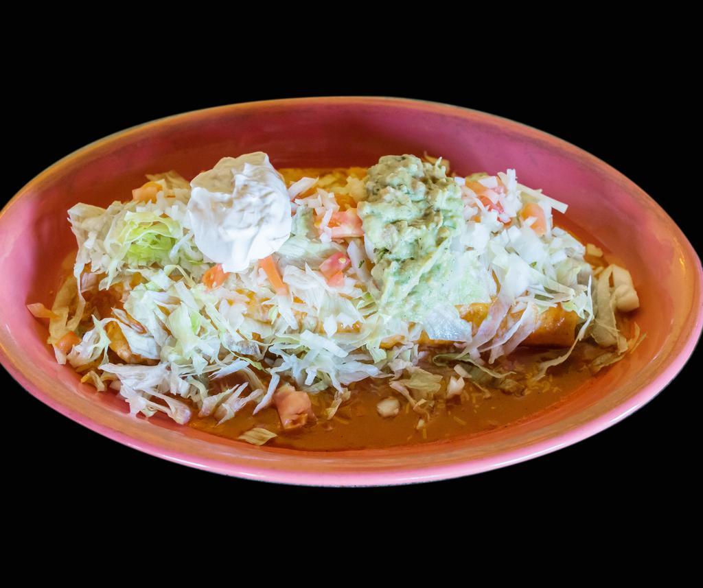 Potrillo Burrito · Flour tortilla with your choice of protein, with rice, choice of beans, and our special burrito sauce with melted cheese. Topped with lettuce, tomato, onion, sour cream and guacamole.
