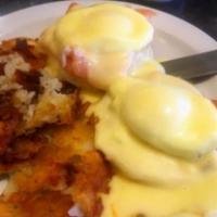 Lox Benedict · 2 eggs poached on top of lox and onions with Hollandaise sauce.