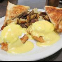 Crabby Benedict · Crab cakes topped with 2 poached eggs and Hollandaise sauce. No English muffin