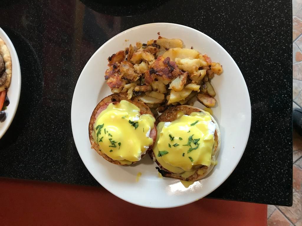 Eggs Benedict · 2 poached eggs on a toasted English muffin, Canadian bacon and Hollandaise sauce.