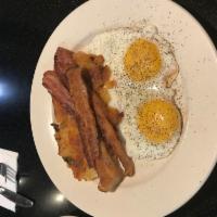2 Eggs any Style with Bacon · Served with home fries and toast.