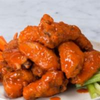 Buffalo Wings · Tossed in buffalo sauce and Served with blue cheese dressing.