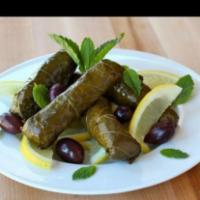 Stuffed Grape Leaves · Served with slice of feta cheese, olives and tomato.