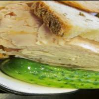 Roast Turkey Sandwich · Served with coleslaw and pickle. Choice of bread.