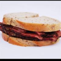 Pastrami Sandwich · Served with coleslaw and pickle. Choice of bread.