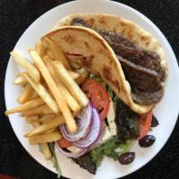 Beef Gyro Platter · Served with Greek salad , French fries and pita..and tzatzik sauce