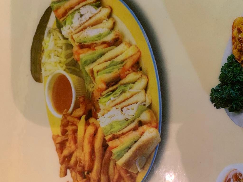 Turkey Club · Served with bacon, lettuce and tomato.  Served with coleslaw and pickle.