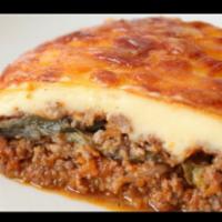 Moussaka · Layers of eggplant, potatoes and seasoned ground beef, topped with bechamel cream sauce and ...