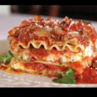 Baked Lasagna · Served with marinara sauce.  Served with choice of side, bread and butter.