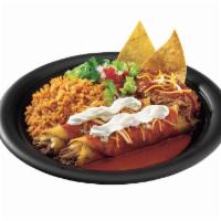 Enchilada · Corn tortilla enchilada made with tender chicken, seasoned ground beef, cheese or pork. Cove...