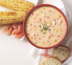 Shrimp & Roasted Corn Chowder · A delightful creamy combination of sweet roasted corn, 
tender shrimp, zesty red peppers and potatoes, finished with 
a touch of spice.