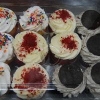 Cupcake Assortment · 12 freshly baked and decorated cupcakes.  4 vanilla with sprinkles, 4 red velvet with cream ...