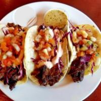 Skirt Steak Chimichurri Tacos (3) · 3 tacos made on corn tortillas, topped with red cabbage, pico de gallo, and chipotle cream. ...