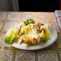Shrimp Taco Salad · Served in a giant totally edible tortilla shell stuffed with mixed green, pico de gallo, che...