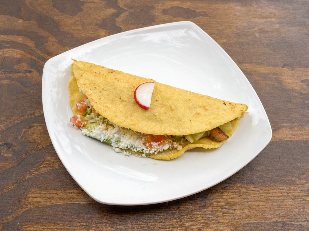 Vegetales Quesadilla · Mixed vegetables. Made with our fresh homemade corn tortillas, served with lettuce, tomato, sour cream, fresh avocado, melted cheese and topped with fresh Mexican cheese.