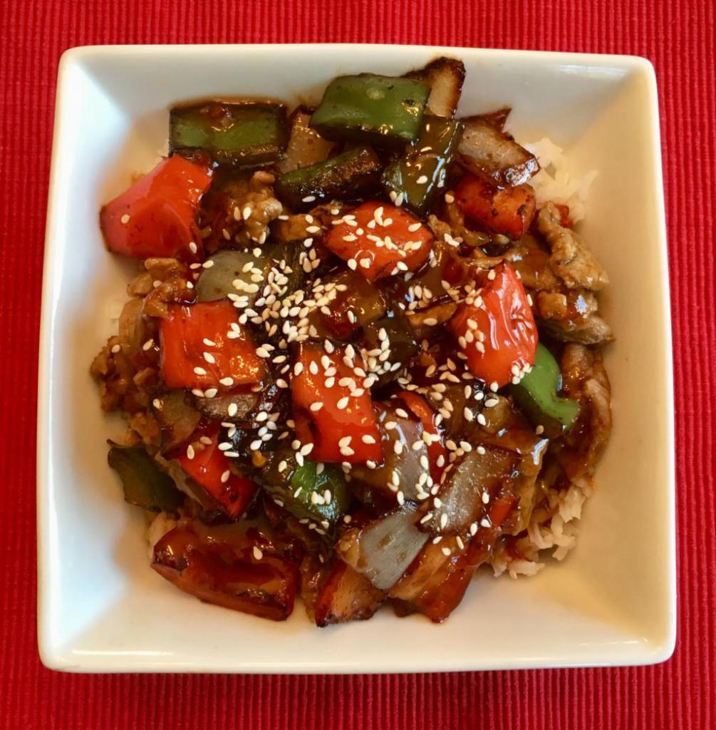 The Pagoda · Delicious beef with sauteed bell peppers and onions in a tangy, sweet sauce. Served over rice with a sprinkle of sesame seeds.