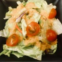 Side Salad · Mixed greens with cherry tomatoes, shredded carrots and a side of our ginger dressing.