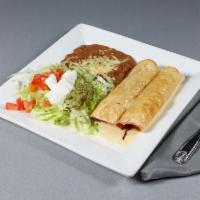 Chimichanga Lunch · Flour tortillas deep fried, filled with shredded beef or chicken. Topped with lettuce, tomat...