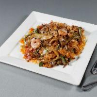 Texas Rice · A bed of rice topped with steak, grilled chicken and shrimp, grilled bell peppers, onions, t...