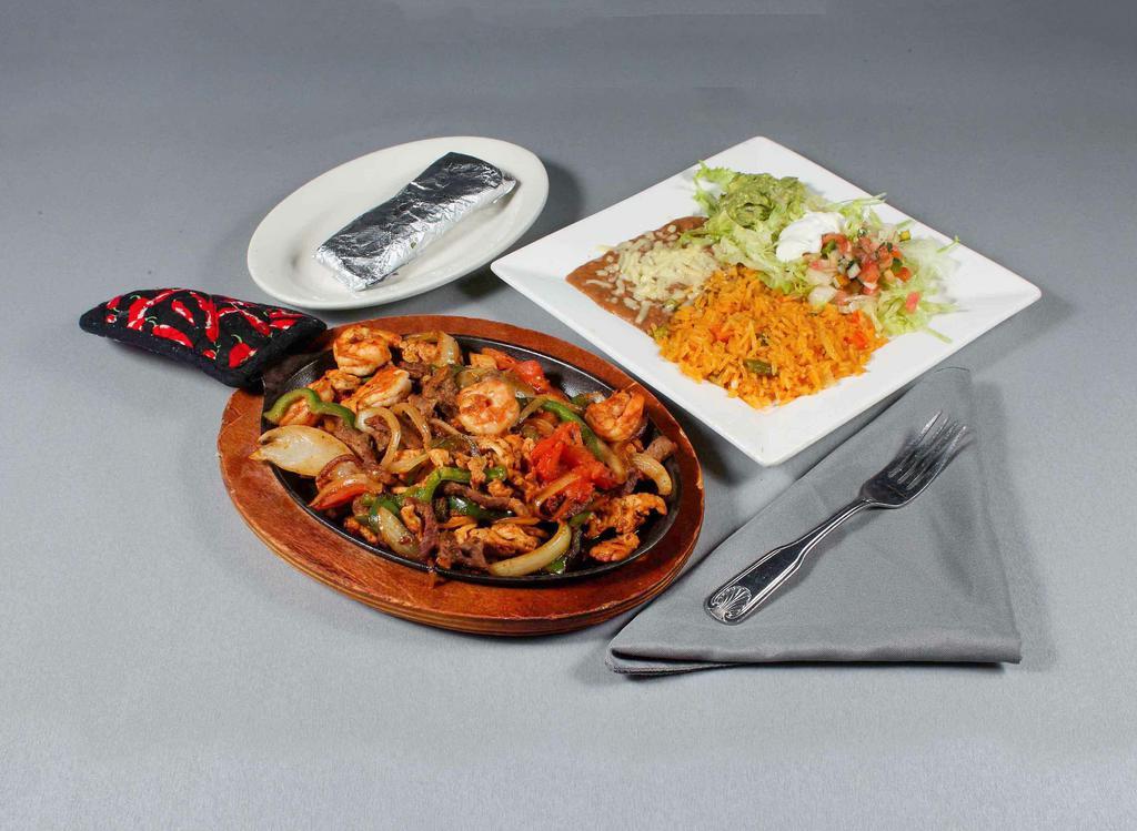 Lunch Fajitas Texana Lunch · Chicken, shrimp and steak fajitas served with beans, Mexican rice, tortillas and sour cream.