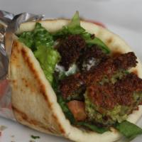 Falafel Sandwich · Served with Lettuce, tomatoes and Tahini sauce or White sauce