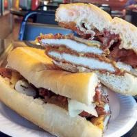 Hungry Man Sandwich · Chicken cutlet, crispy bacon, mozzarella cheese, lettuce and tomatoes.